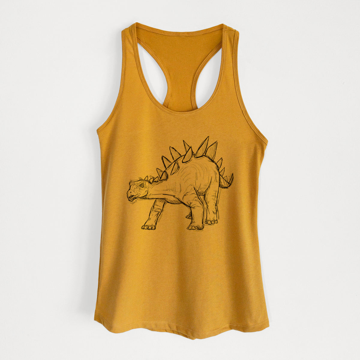 Gold women's racerback tank top laid flat, printed with a black ink illustration of a Stegosaurus with plates along its back.