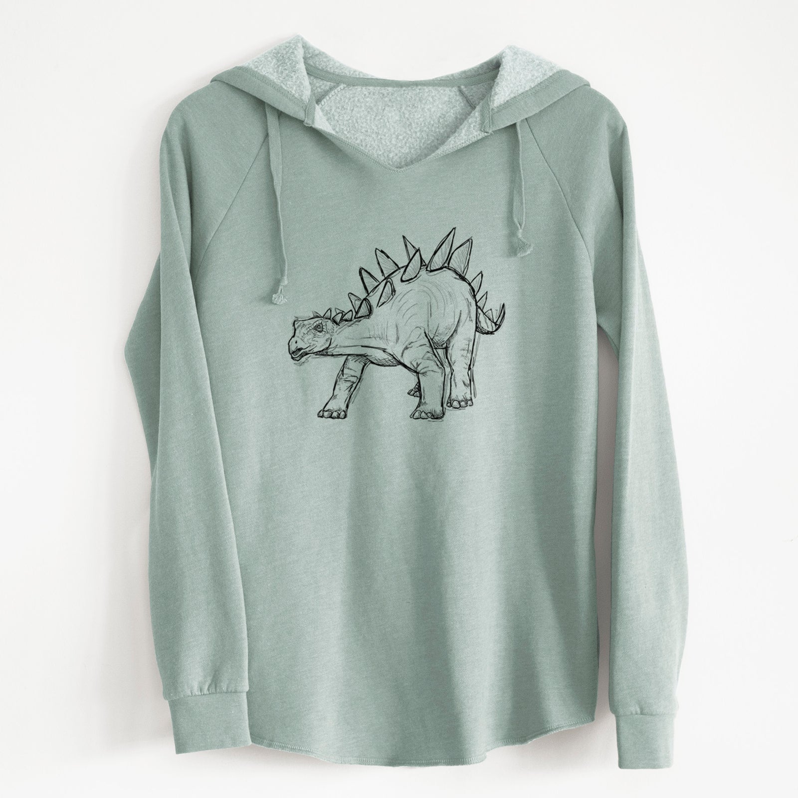 Sage green women's Cali Wave hooded sweatshirt laid flat, printed with a black ink illustration of a Stegosaurus with plates along its back.