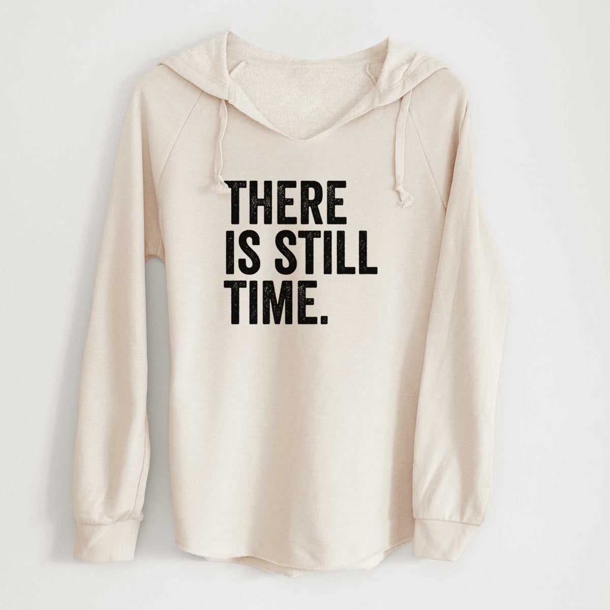 Bone cream women's Cali Wave hooded sweatshirt laid flat, printed with bold black words reading There Is Still Time.
