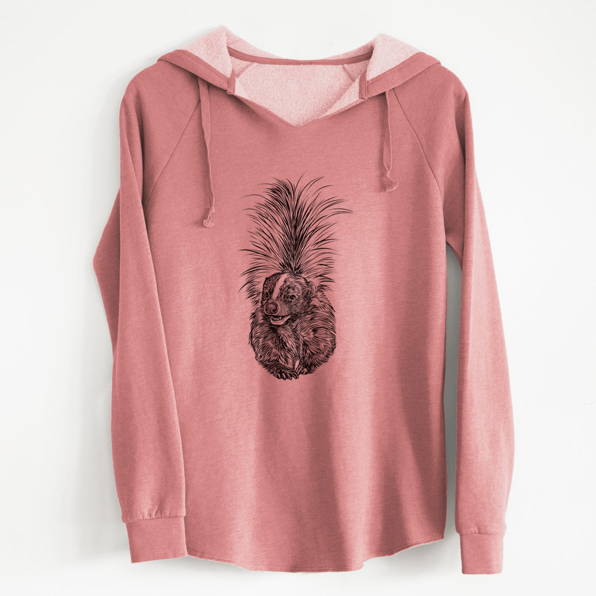 Dusty rose women's Cali Wave hooded sweatshirt laid flat, printed with a detailed black ink illustration of a striped skunk with its tail raised.