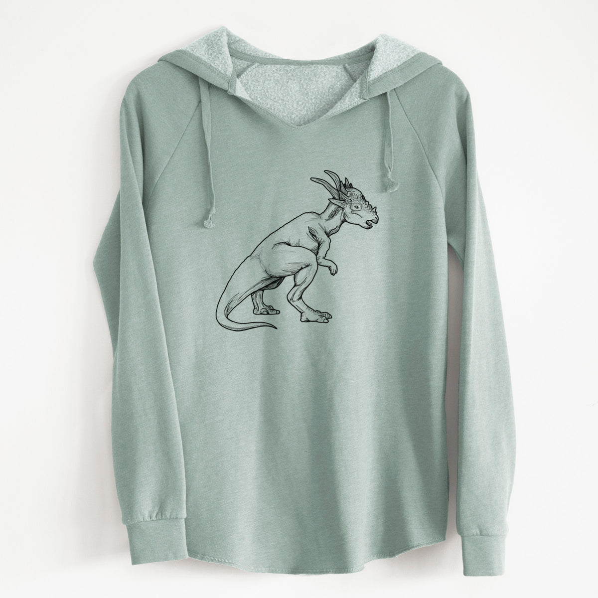 Sage green women's Cali Wave hooded sweatshirt laid flat, printed with a black ink illustration of a Stygimoloch dinosaur with a spiky domed head.