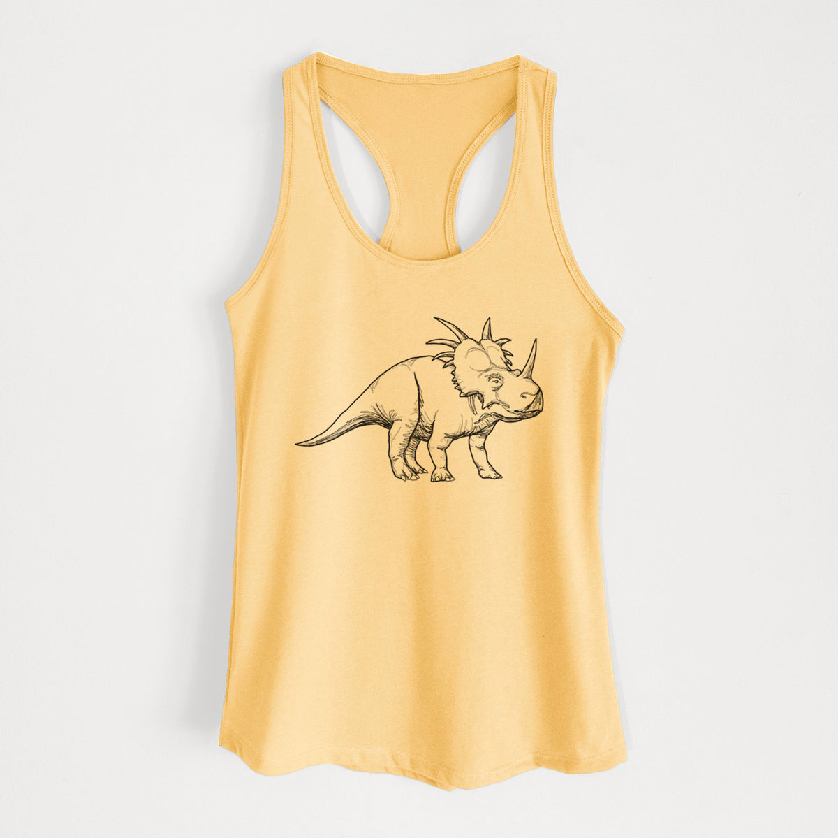 Banana cream women's racerback tank top laid flat, printed with a black ink illustration of a Styracosaurus with its spiked frill.