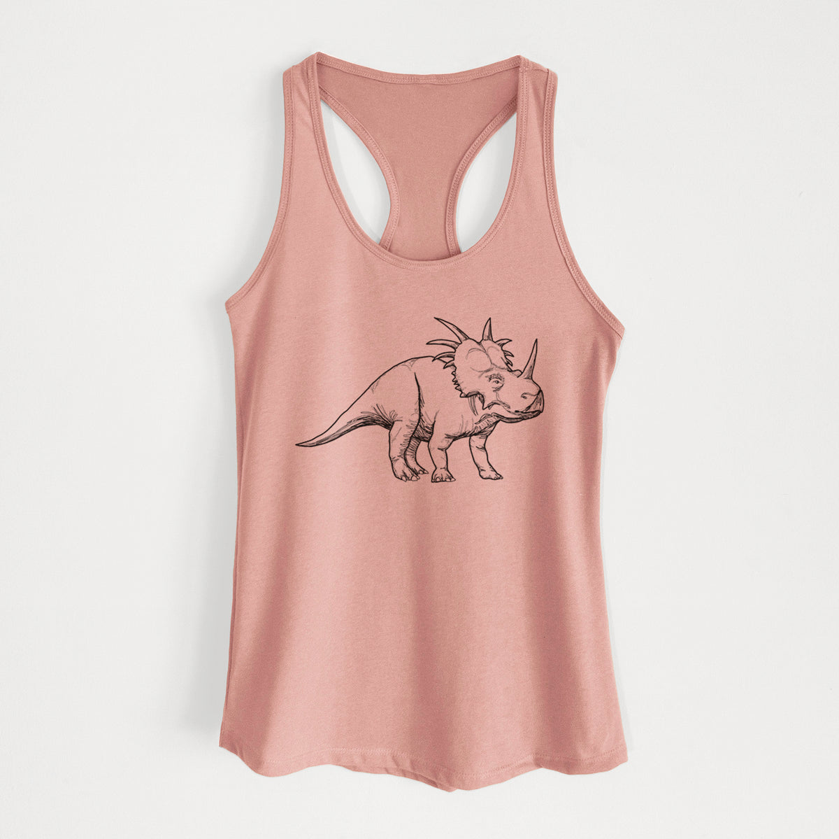 Desert pink women's racerback tank top laid flat, printed with a black ink illustration of a Styracosaurus with its spiked frill.