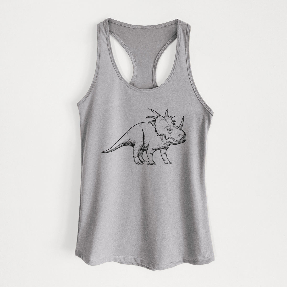 Heather grey women's racerback tank top laid flat, printed with a black ink illustration of a Styracosaurus with its spiked frill.