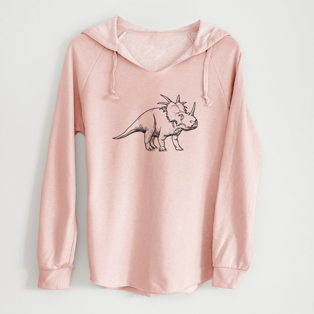 Blush pink women's Cali Wave hooded sweatshirt laid flat, printed with a black ink illustration of a Styracosaurus with its spiked frill.
