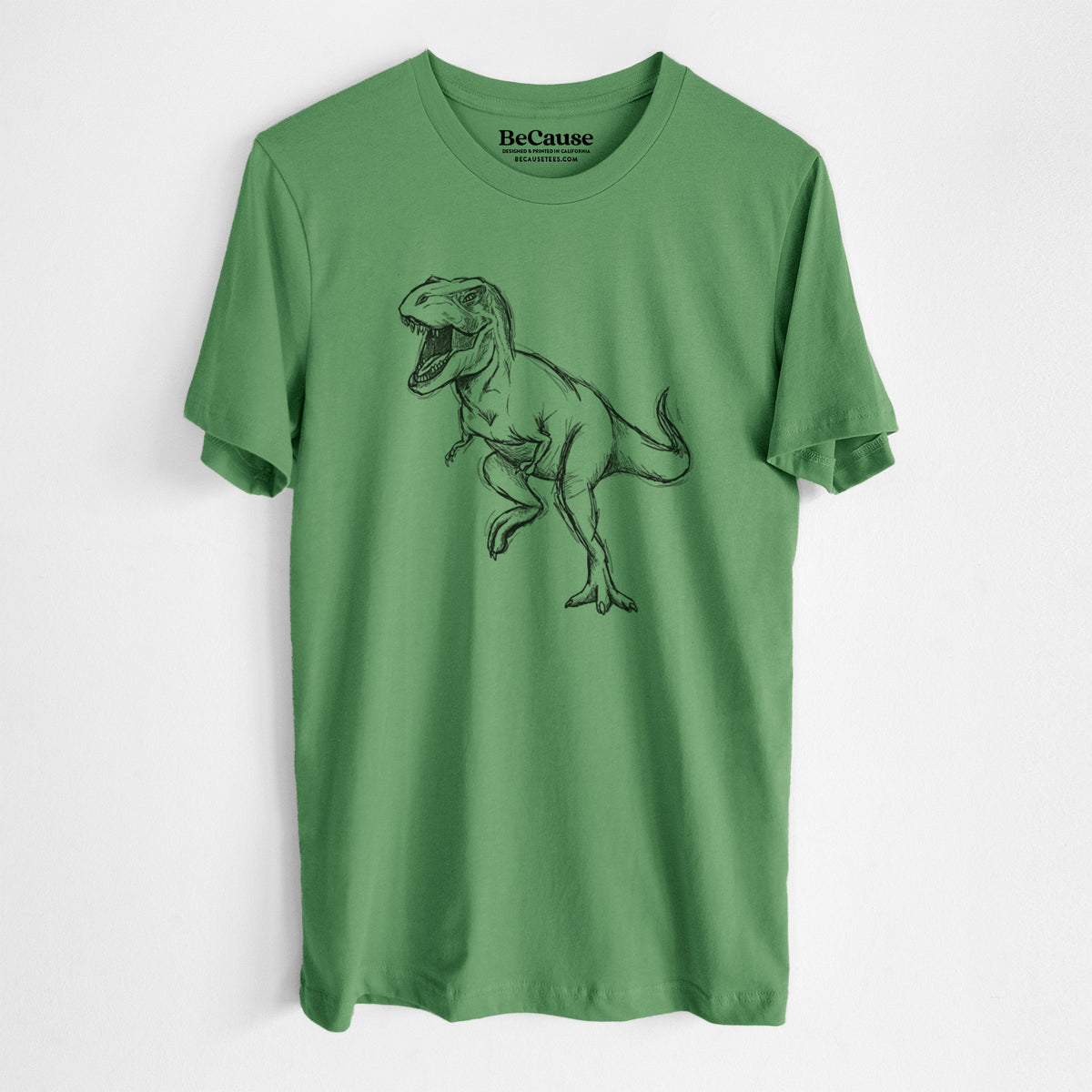 Leaf green lightweight cotton t-shirt laid flat, printed with a black ink illustration of a Tyrannosaurus rex roaring.