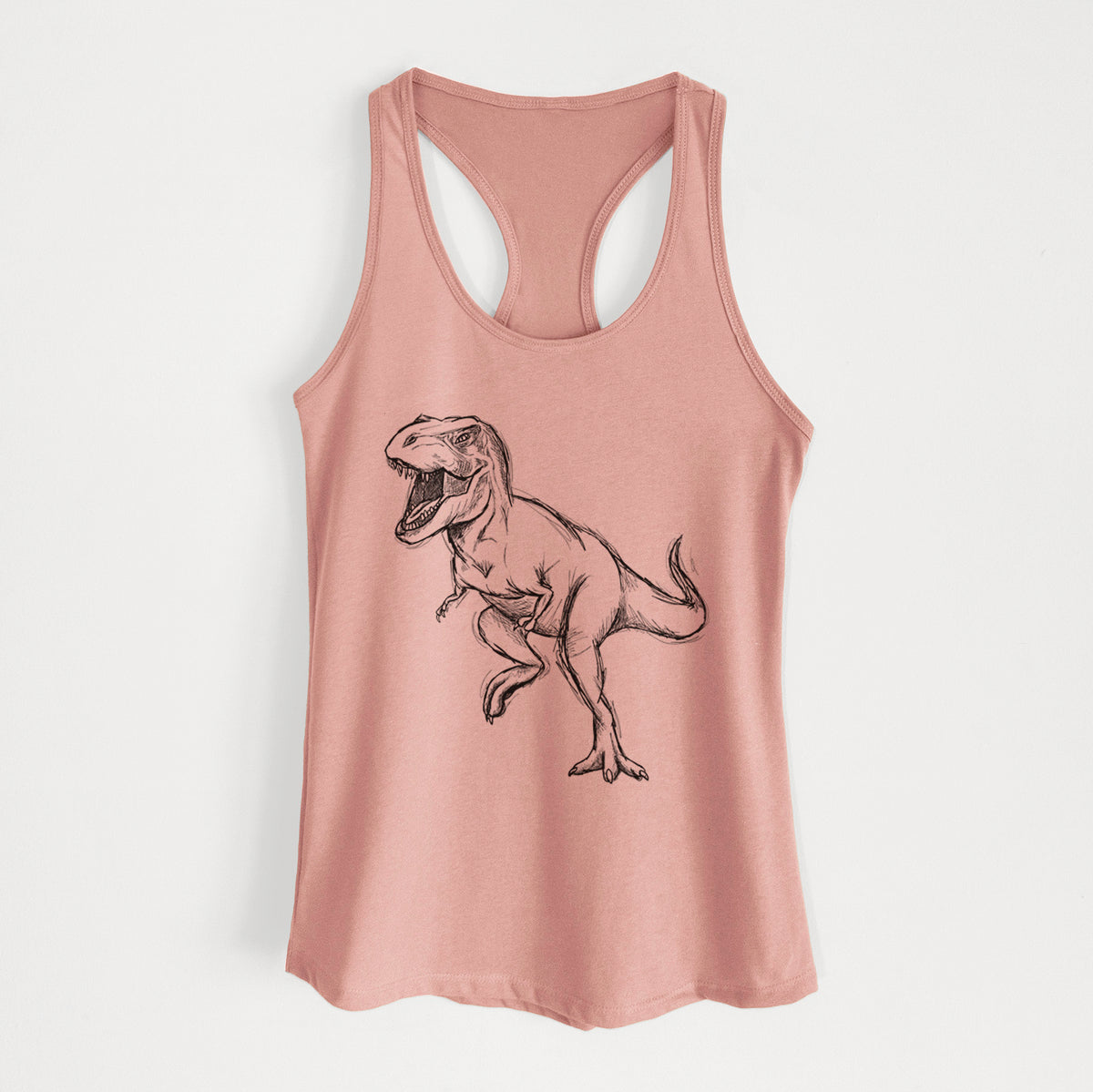 Desert pink women's racerback tank top laid flat, printed with a black ink illustration of a Tyrannosaurus rex roaring.