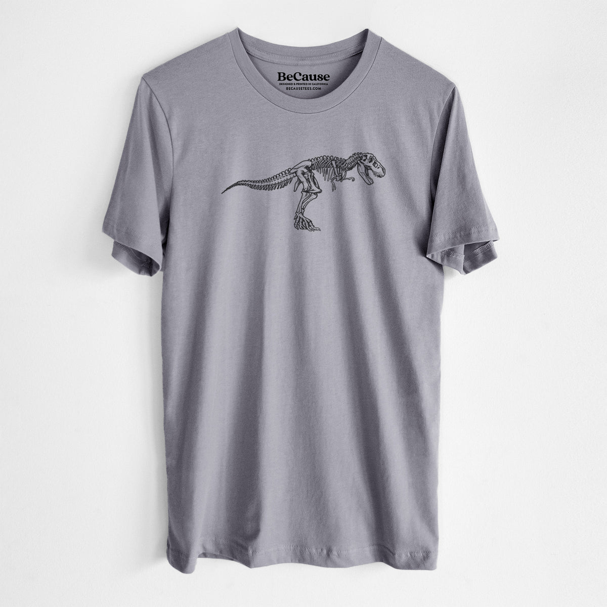Storm grey lightweight cotton t-shirt laid flat, printed with a black ink illustration of a Tyrannosaurus rex skeleton.