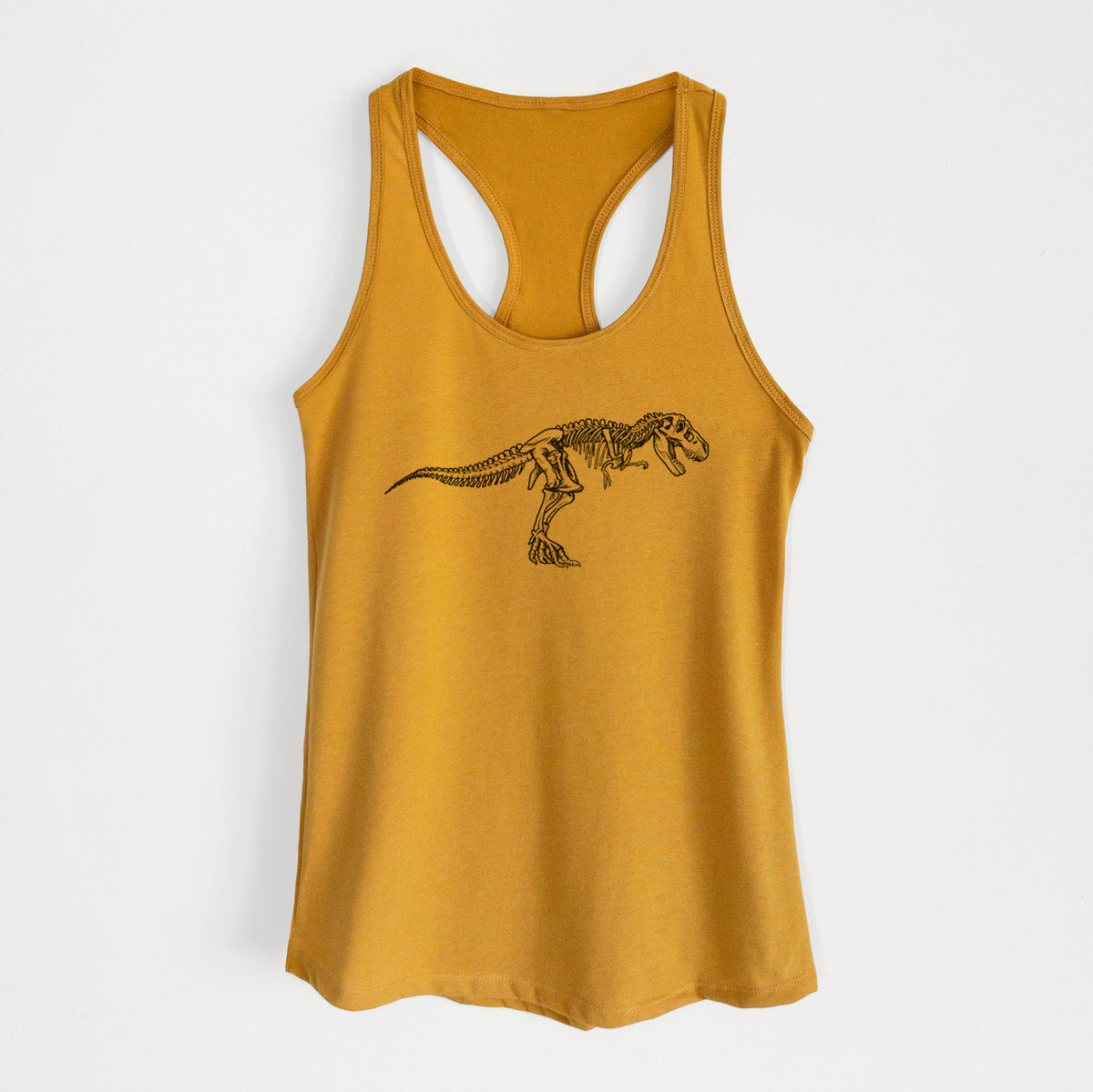 Gold women's racerback tank top laid flat, printed with a black ink illustration of a Tyrannosaurus rex skeleton.