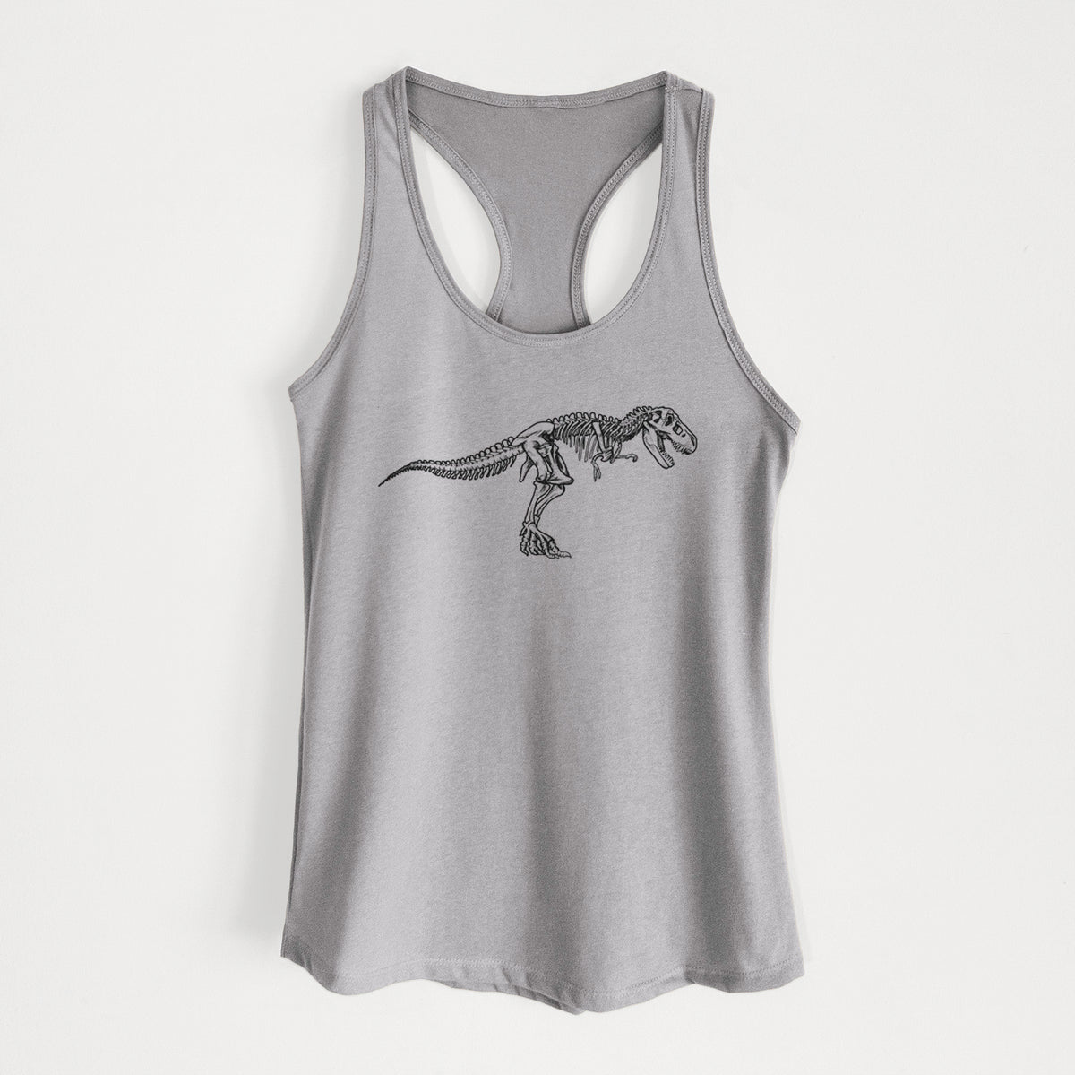 Heather grey women's racerback tank top laid flat, printed with a black ink illustration of a Tyrannosaurus rex skeleton.