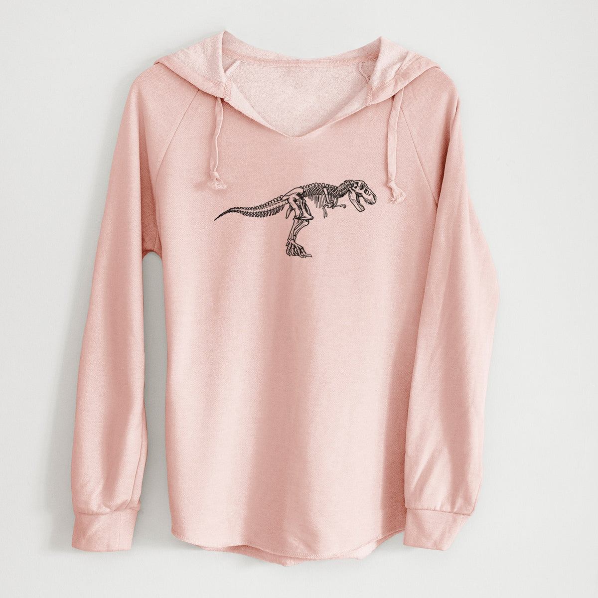 Blush pink women's Cali Wave hooded sweatshirt laid flat, printed with a black ink illustration of a Tyrannosaurus rex skeleton.