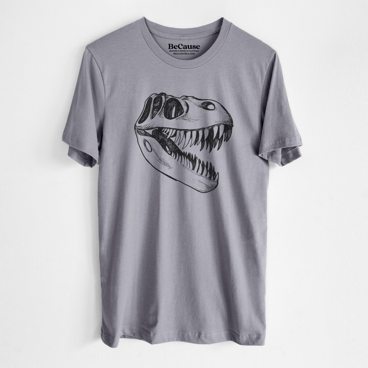 Storm grey lightweight cotton t-shirt laid flat, printed with a black ink illustration of a Tyrannosaurus rex skull with sharp teeth.