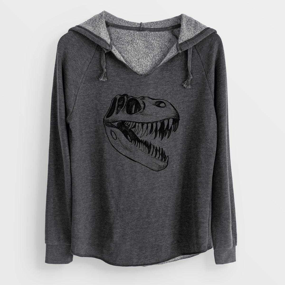 Charcoal grey women's Cali Wave hooded sweatshirt laid flat, printed with a black ink illustration of a Tyrannosaurus rex skull with sharp teeth.