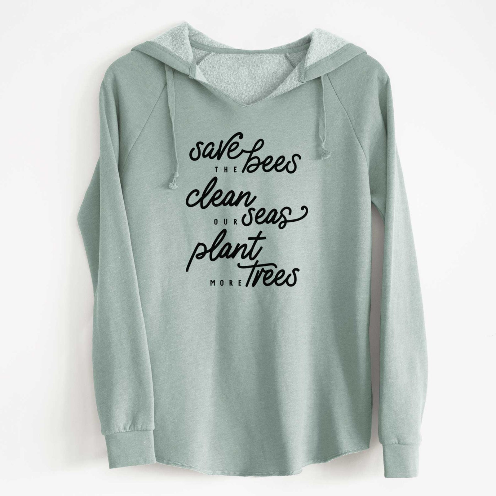 Sage green women's Cali Wave hooded sweatshirt laid flat, printed with black hand-lettered words reading Save the Bees, Clean Our Seas, Plant More Trees.