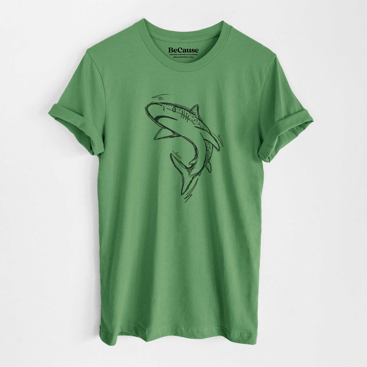 Leaf green lightweight cotton t-shirt laid flat, printed with a black ink illustration of a tiger shark swimming in a curve.