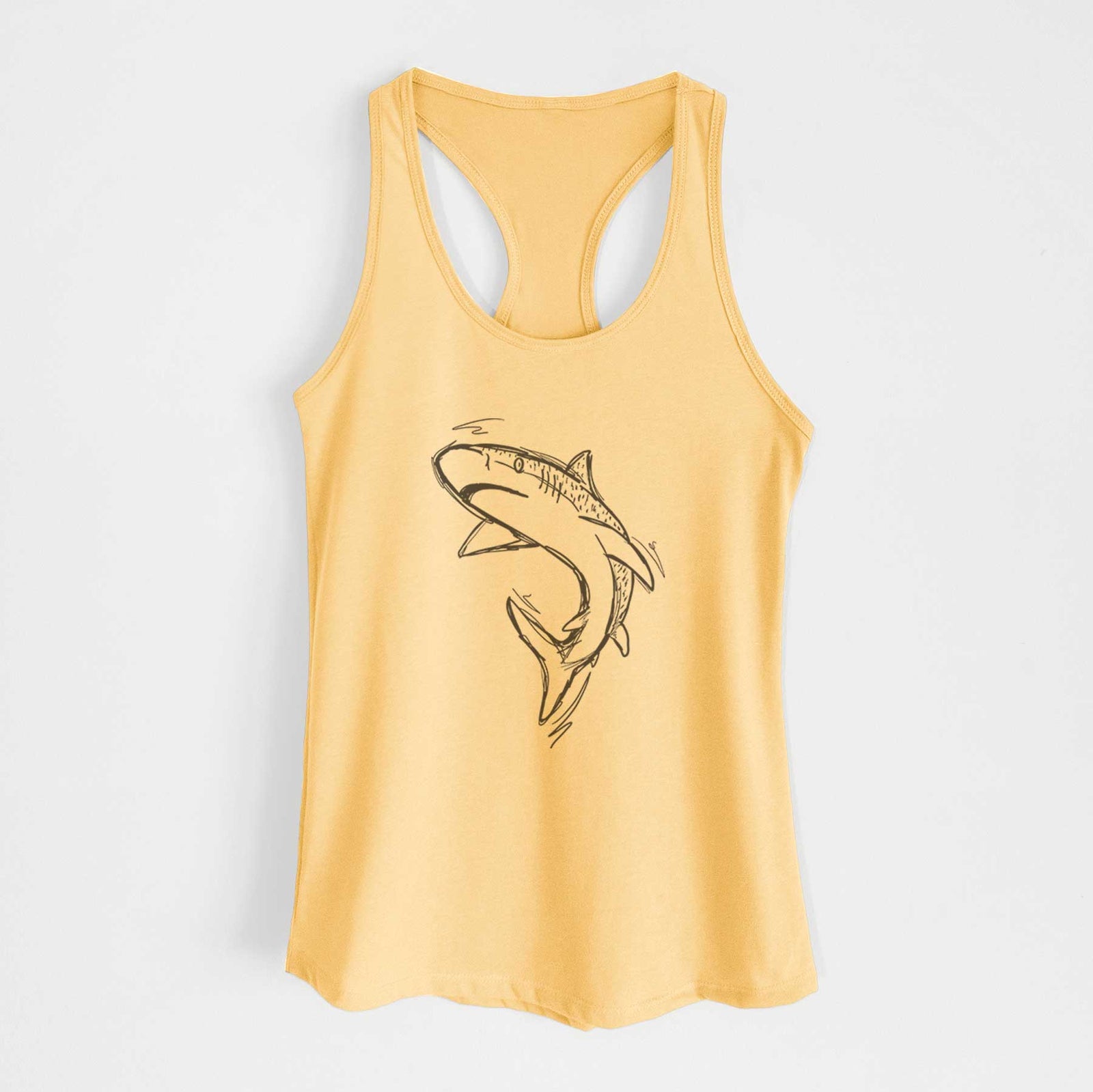 Banana cream women's racerback tank top laid flat, printed with a black ink illustration of a tiger shark swimming in a curve.