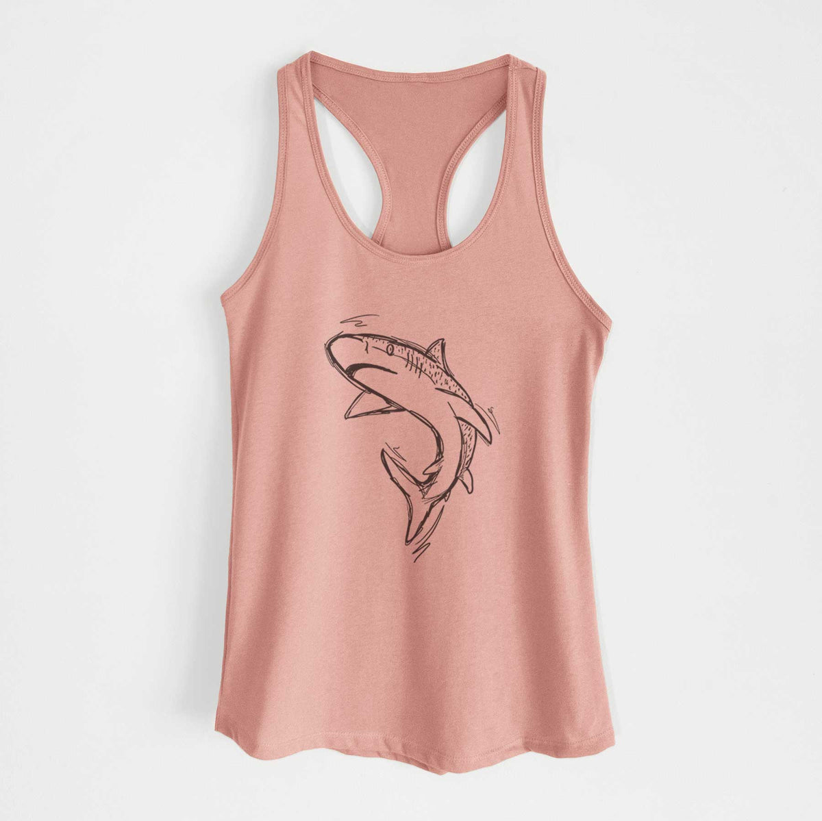 Desert pink women's racerback tank top laid flat, printed with a black ink illustration of a tiger shark swimming in a curve.