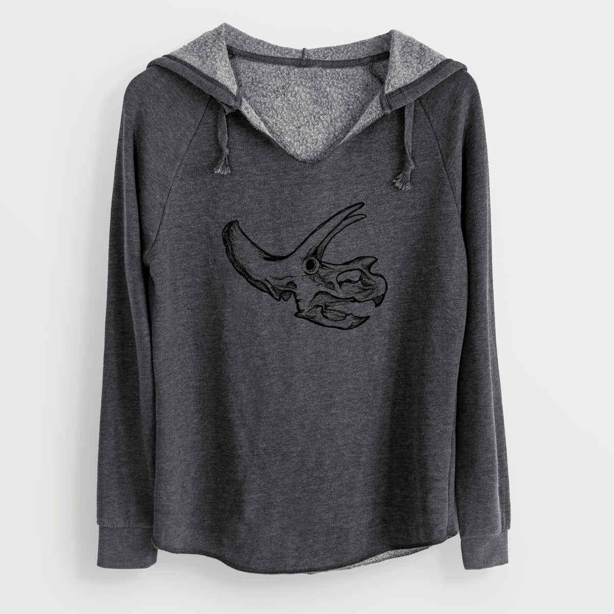 Charcoal grey women's Cali Wave hooded sweatshirt laid flat, printed with a detailed black ink illustration of a Triceratops skull with its horns and frill.