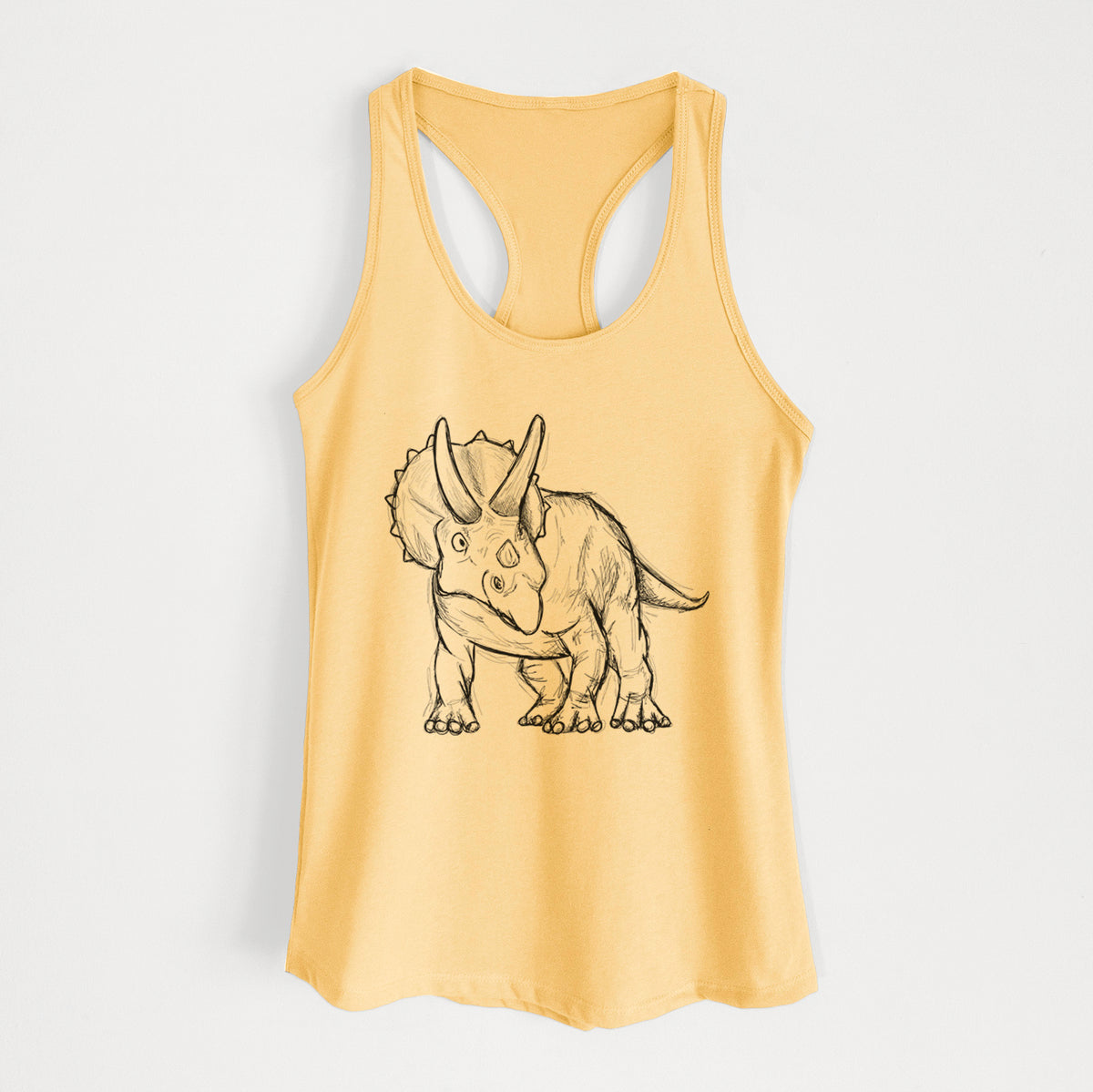 Banana cream women's racerback tank top laid flat, printed with a black ink illustration of a Triceratops walking.