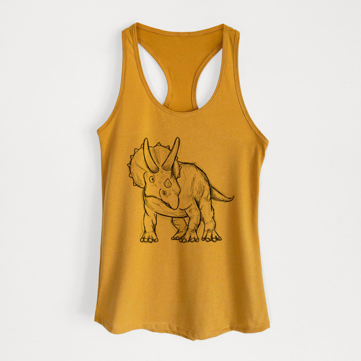 Gold women's racerback tank top laid flat, printed with a black ink illustration of a Triceratops walking.