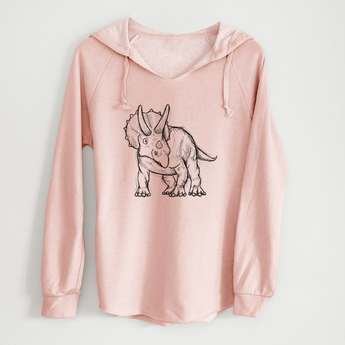 Blush pink women's Cali Wave hooded sweatshirt laid flat, printed with a black ink illustration of a Triceratops walking.
