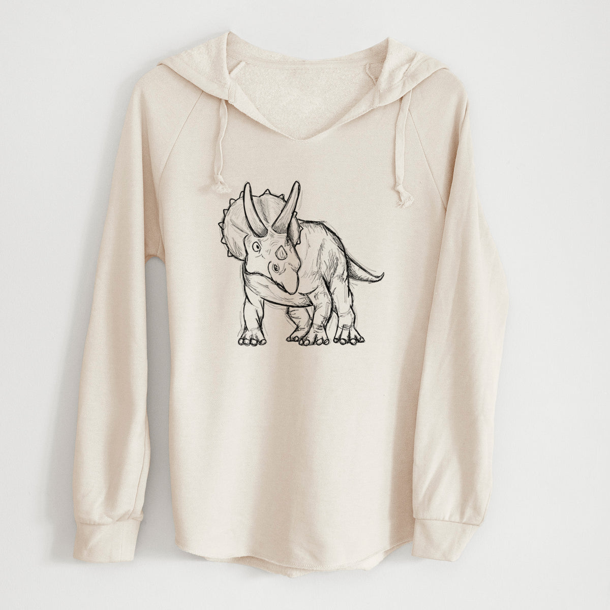 Bone cream women's Cali Wave hooded sweatshirt laid flat, printed with a black ink illustration of a Triceratops walking.