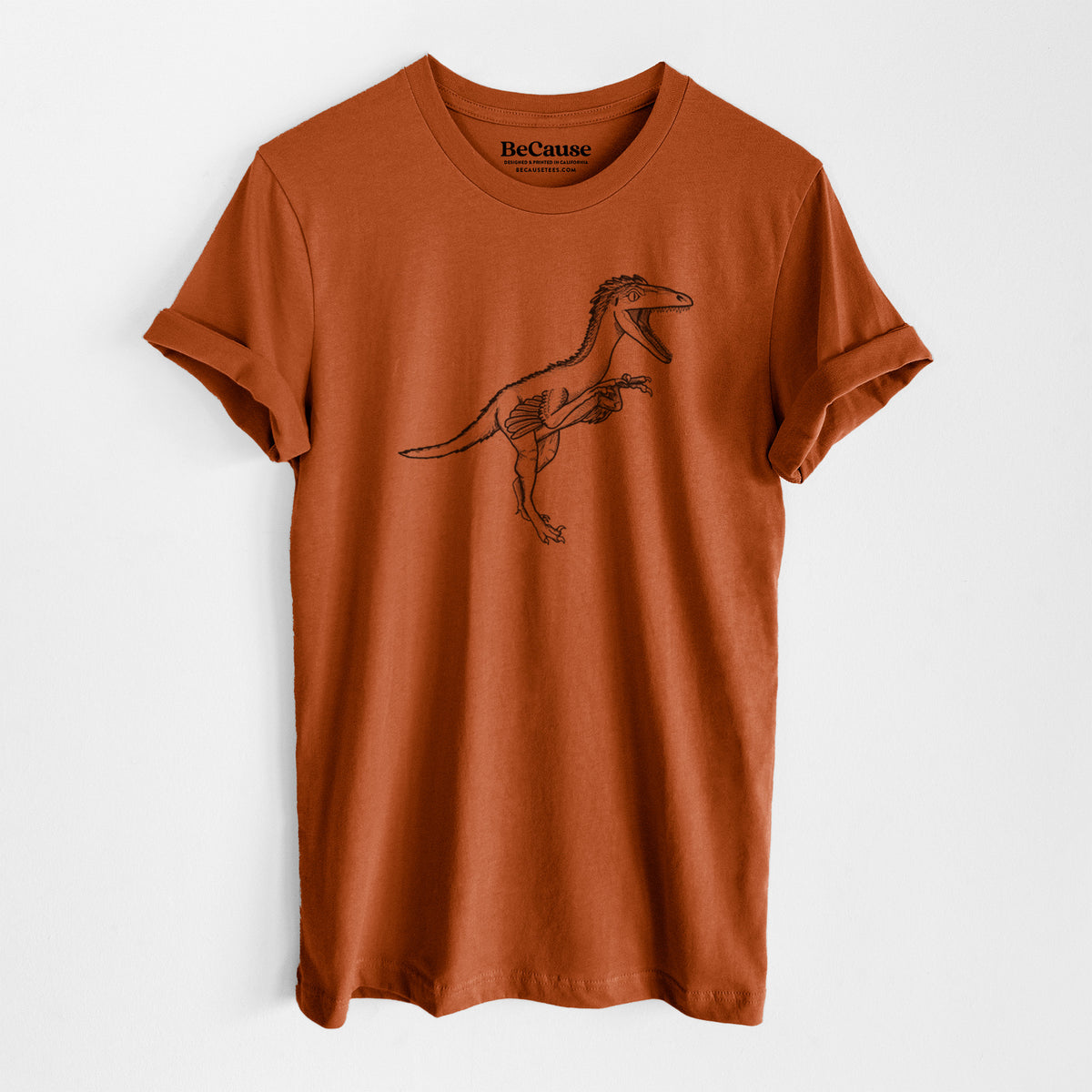 Autumn lightweight cotton t-shirt laid flat, printed with a black ink illustration of a Troodon dinosaur running.