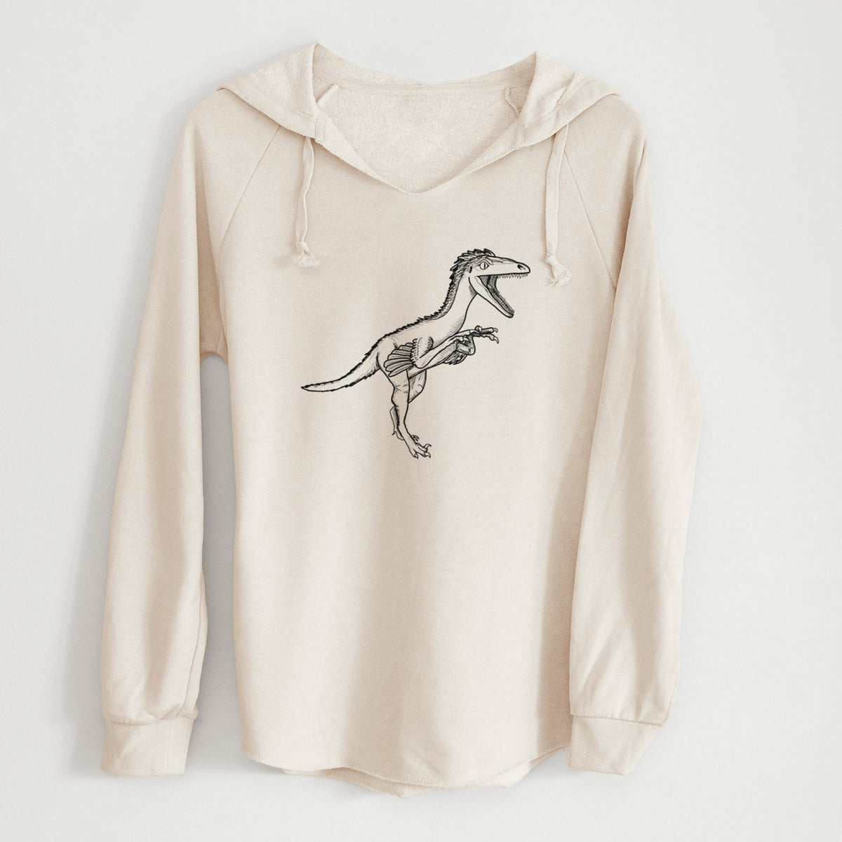 Bone cream women's Cali Wave hooded sweatshirt laid flat, printed with a black ink illustration of a Troodon dinosaur running.