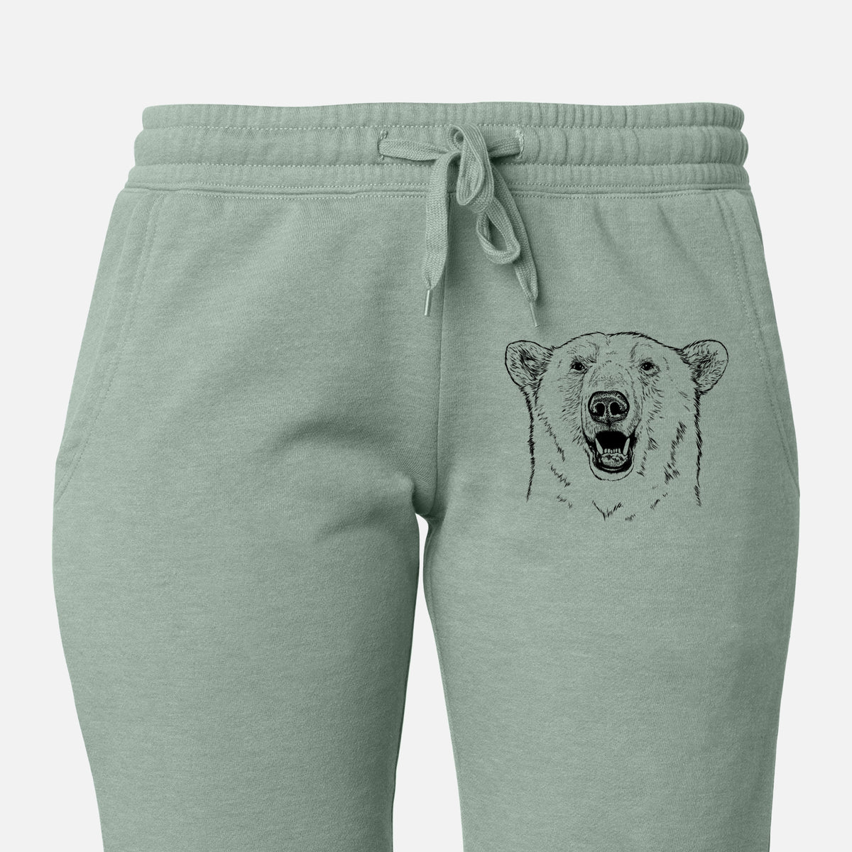 Front of sage green Cali Wave sweatpants, printed with a black ink portrait of a smiling polar bear's face on the leg.