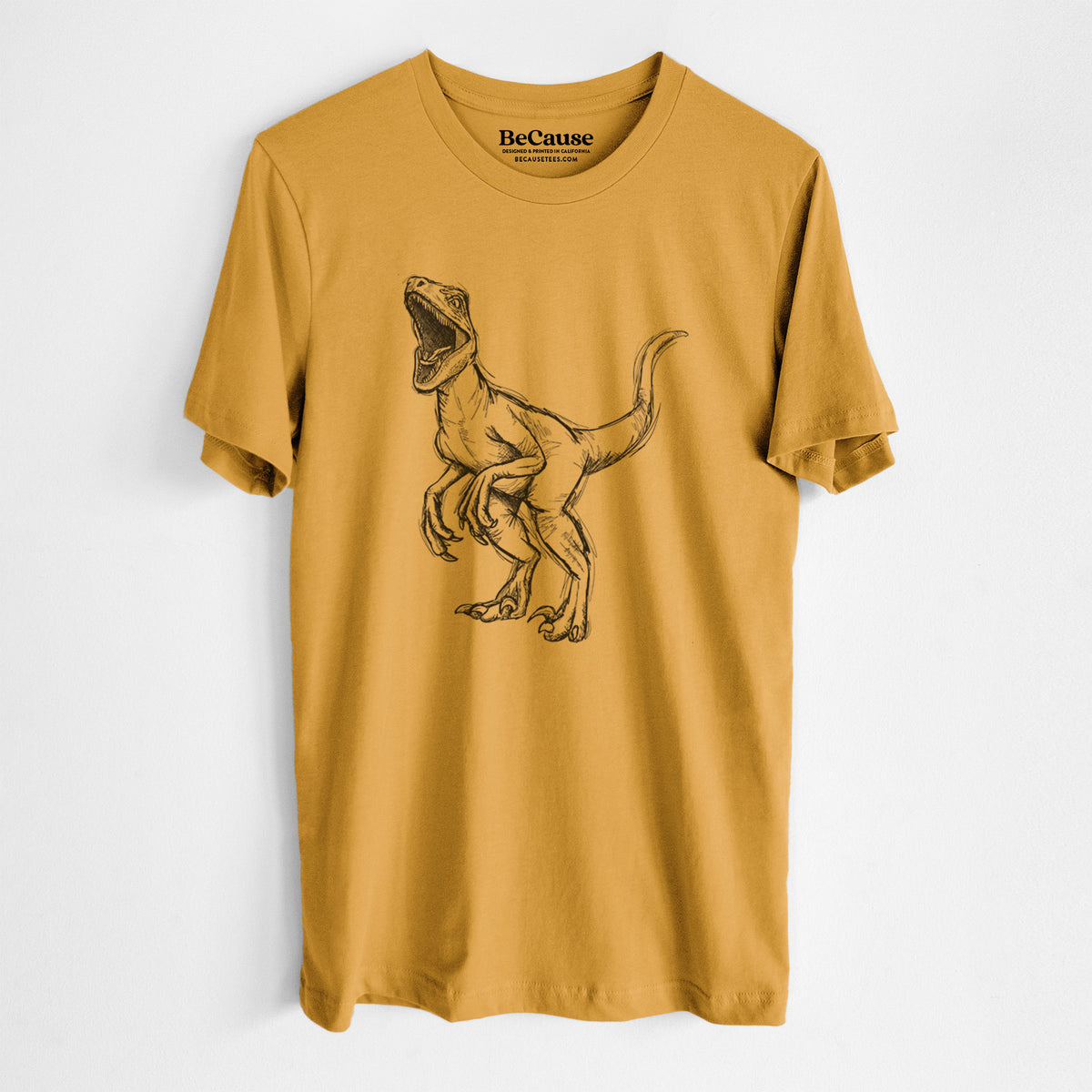 Mustard yellow lightweight cotton t-shirt laid flat, printed with a black ink illustration of a Velociraptor roaring.