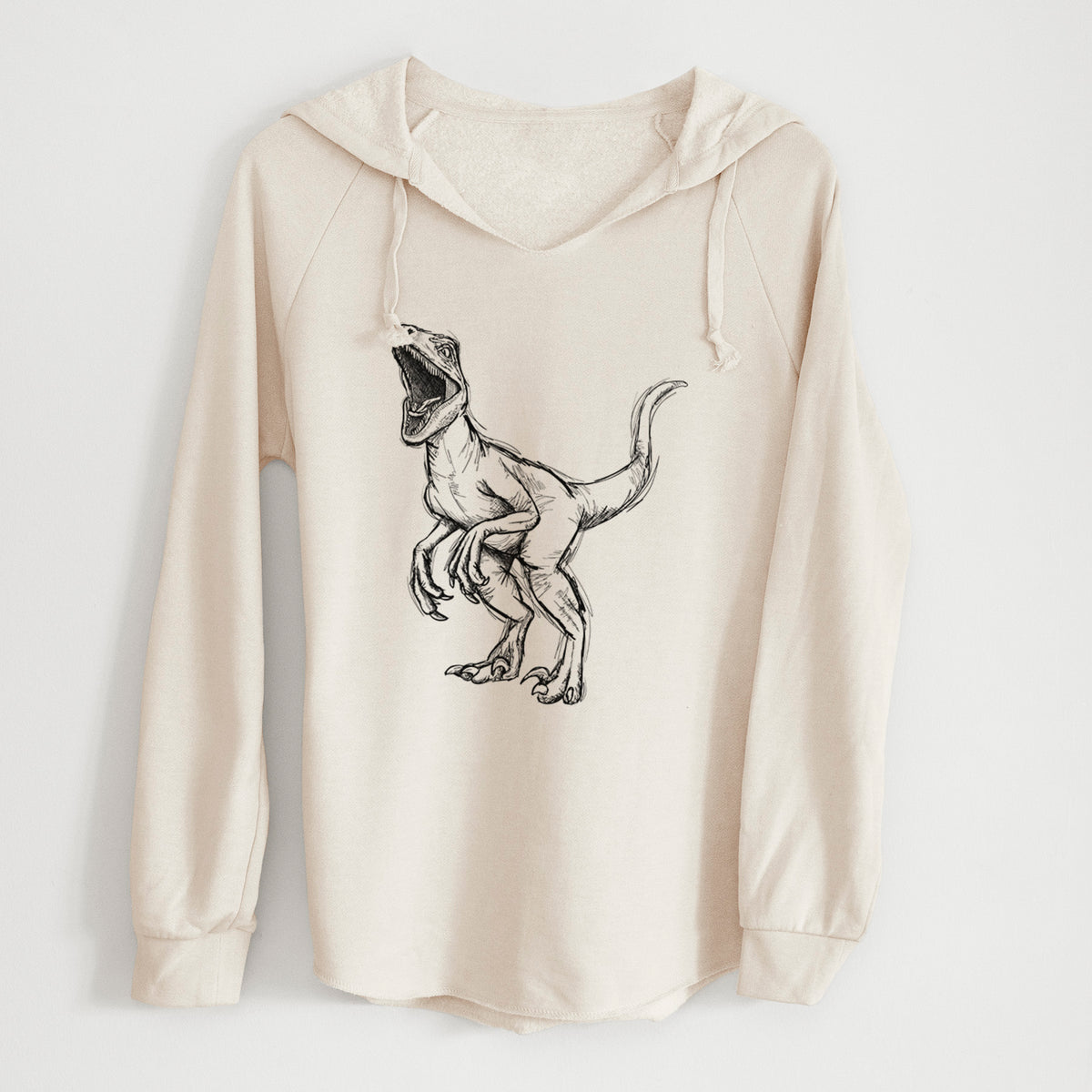 Bone cream women's Cali Wave hooded sweatshirt laid flat, printed with a black ink illustration of a Velociraptor roaring.