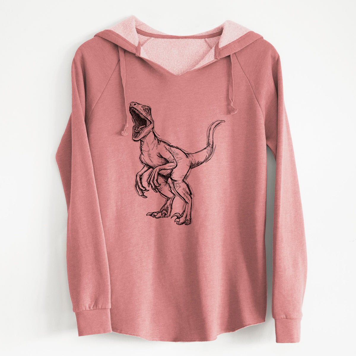 Dusty rose women's Cali Wave hooded sweatshirt laid flat, printed with a black ink illustration of a Velociraptor roaring.