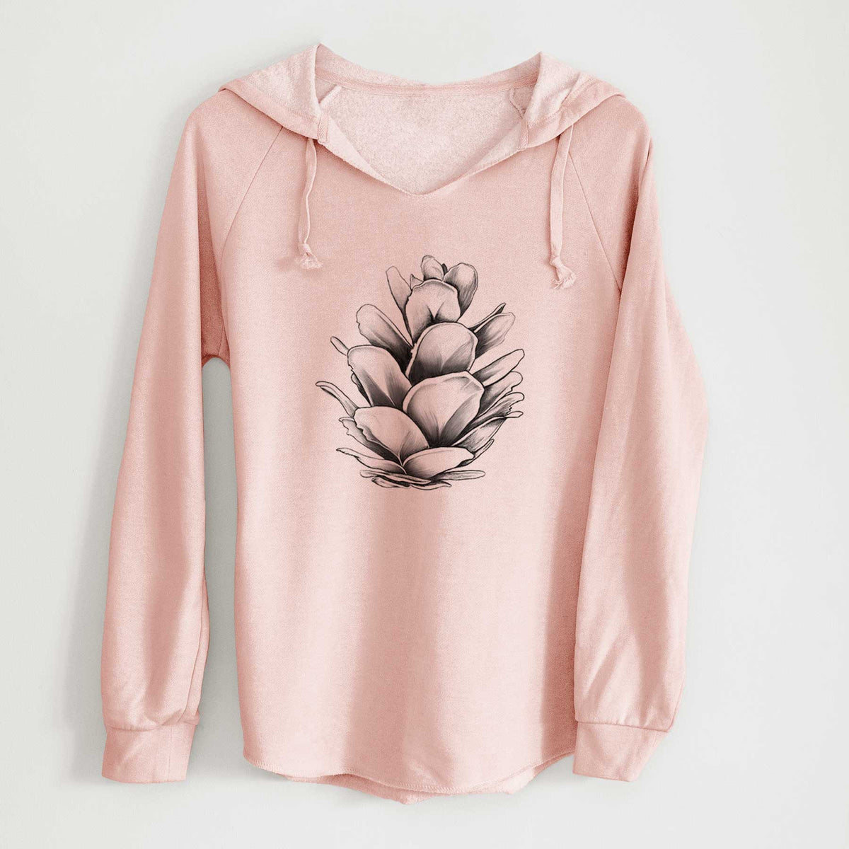 Blush pink women's Cali Wave hooded sweatshirt laid flat, printed with a detailed black ink illustration of a western hemlock pine cone.