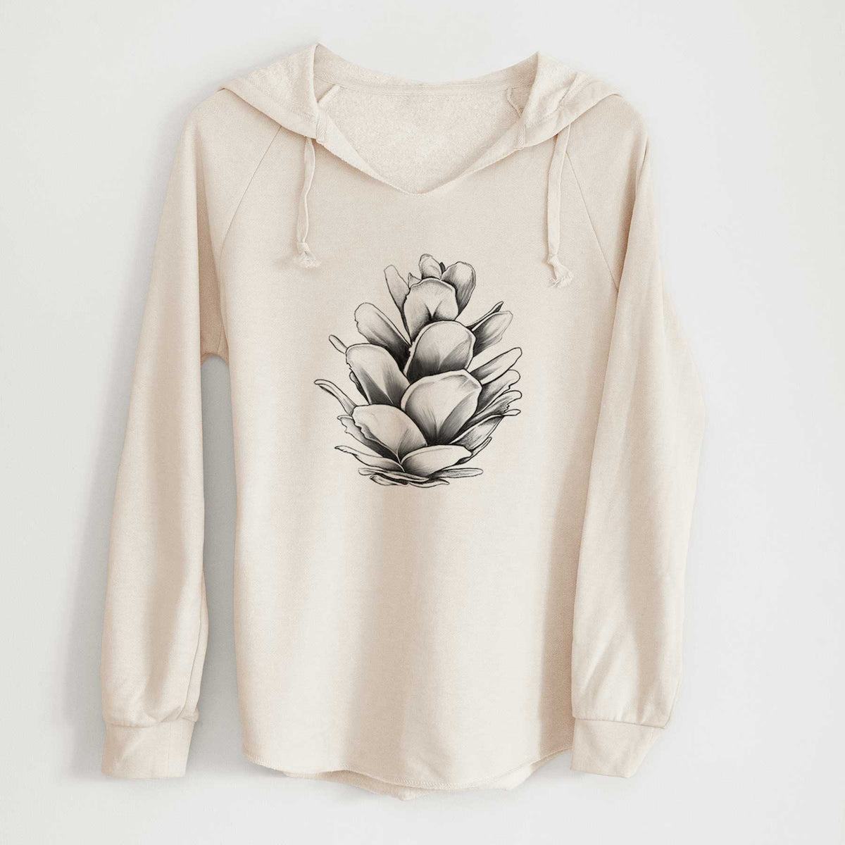 Bone cream women's Cali Wave hooded sweatshirt laid flat, printed with a detailed black ink illustration of a western hemlock pine cone.