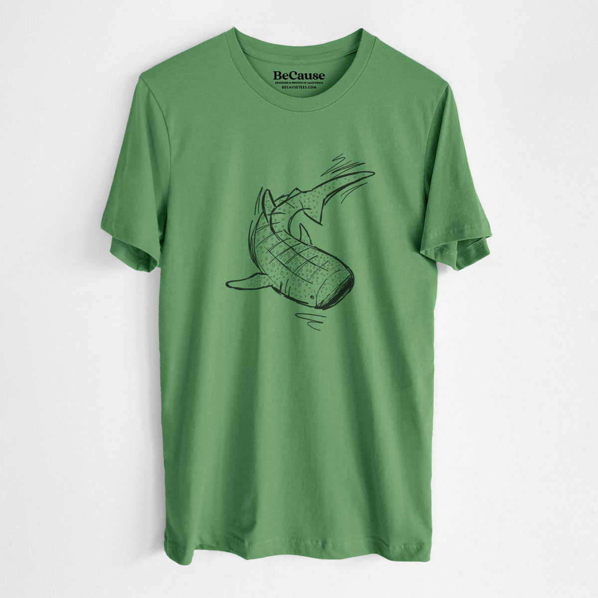Leaf green lightweight cotton t-shirt laid flat, printed with a black ink illustration of a spotted whale shark swimming.