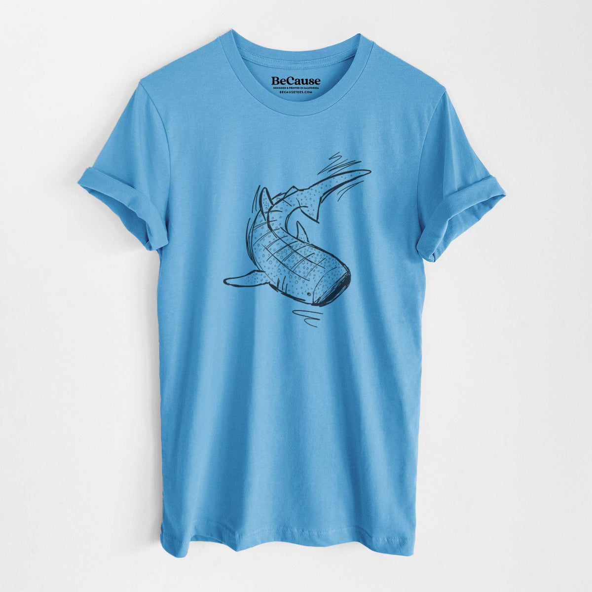 Ocean blue lightweight cotton t-shirt laid flat, printed with a black ink illustration of a spotted whale shark swimming.