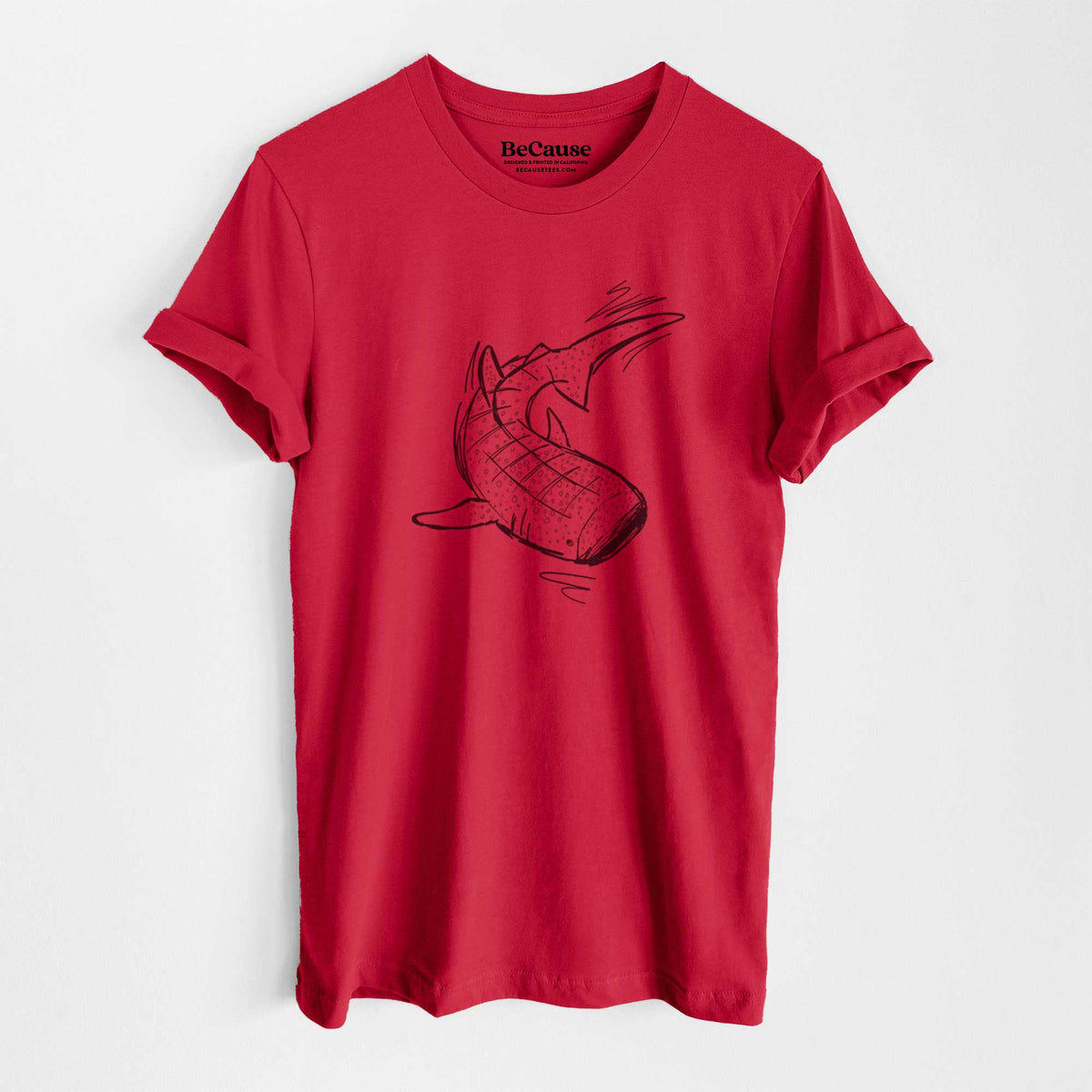 Ruby red lightweight cotton t-shirt laid flat, printed with a black ink illustration of a spotted whale shark swimming.