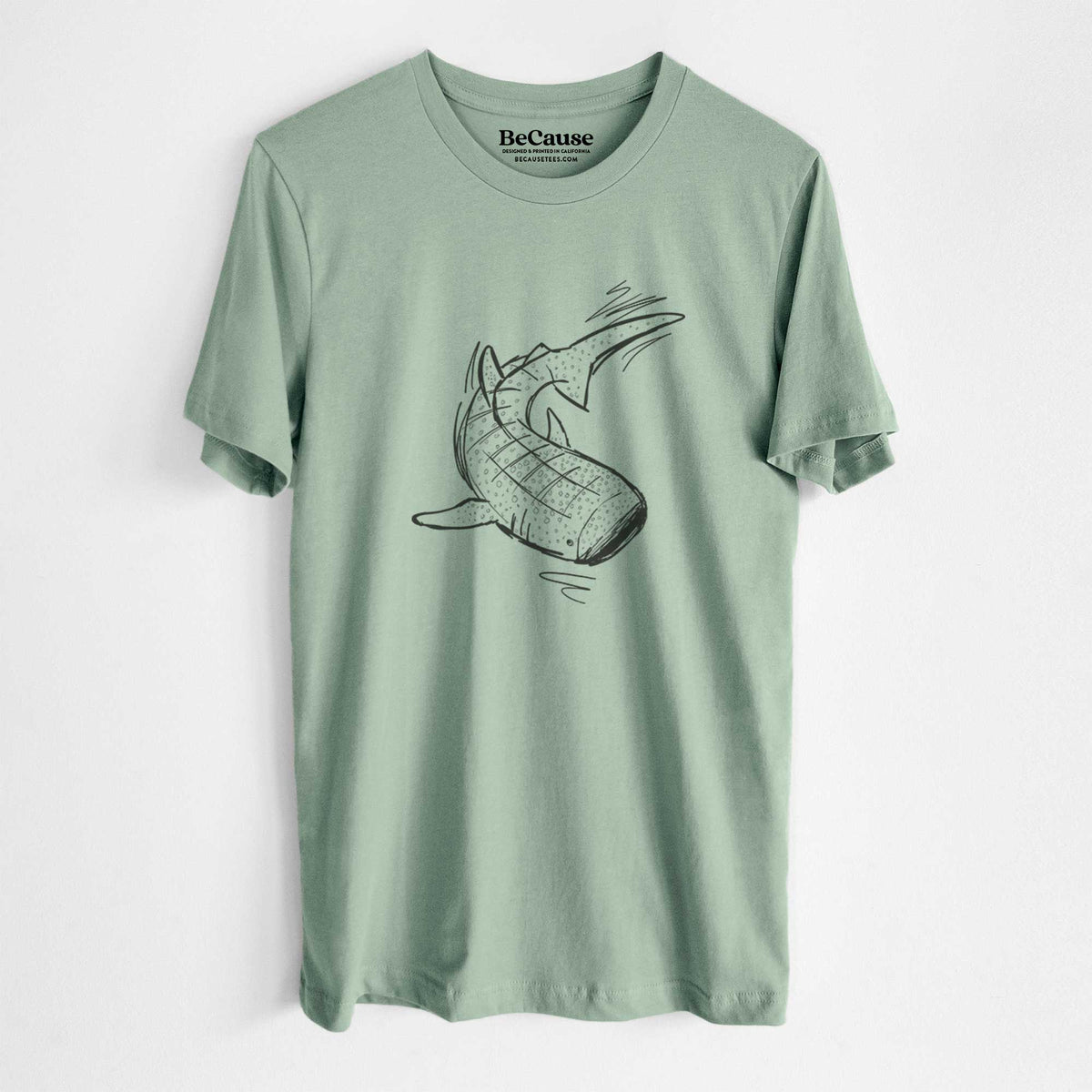 Sage green lightweight cotton t-shirt laid flat, printed with a black ink illustration of a spotted whale shark swimming.