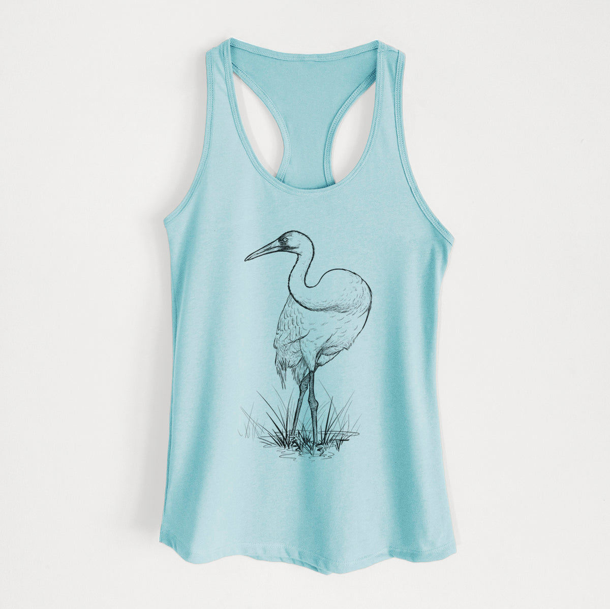 Cancun blue women's racerback tank top laid flat, printed with a detailed black ink illustration of a whooping crane standing in grass.