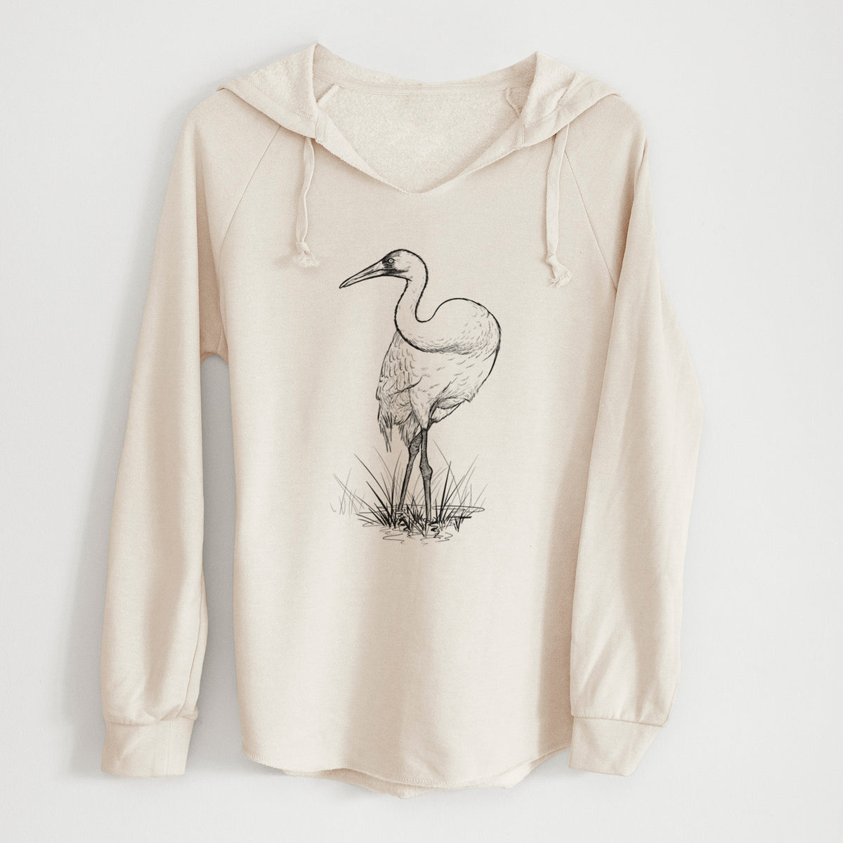 Bone cream women's Cali Wave hooded sweatshirt laid flat, printed with a detailed black ink illustration of a whooping crane standing in grass.
