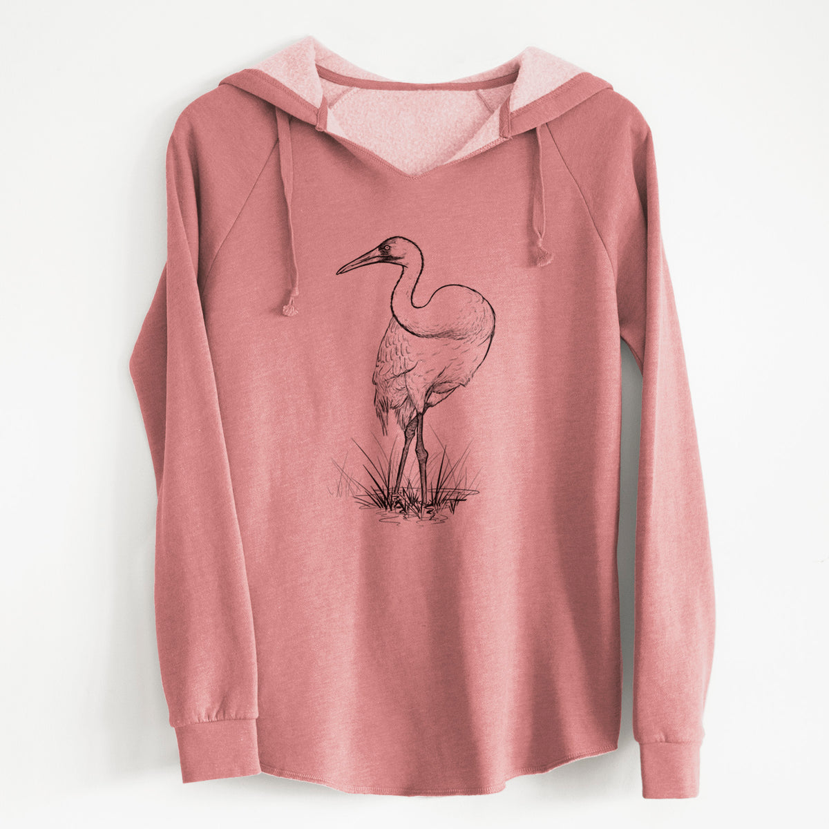 Dusty rose women's Cali Wave hooded sweatshirt laid flat, printed with a detailed black ink illustration of a whooping crane standing in grass.