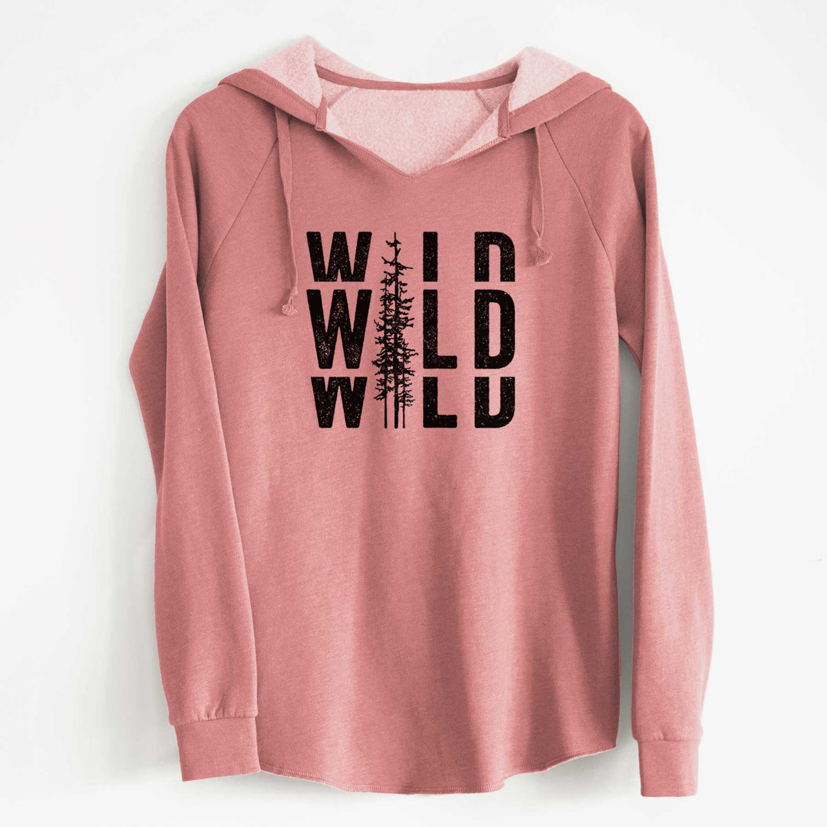 Dusty rose women's Cali Wave hooded sweatshirt laid flat, printed with bold black text reading WILD stacked three times, with a tall pine tree forming the letter I.