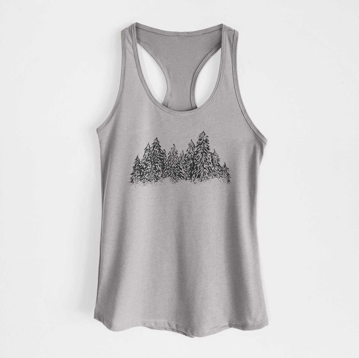 Heather grey women's racerback tank top laid flat, printed with a black ink illustration of a row of snow-dusted evergreen trees.