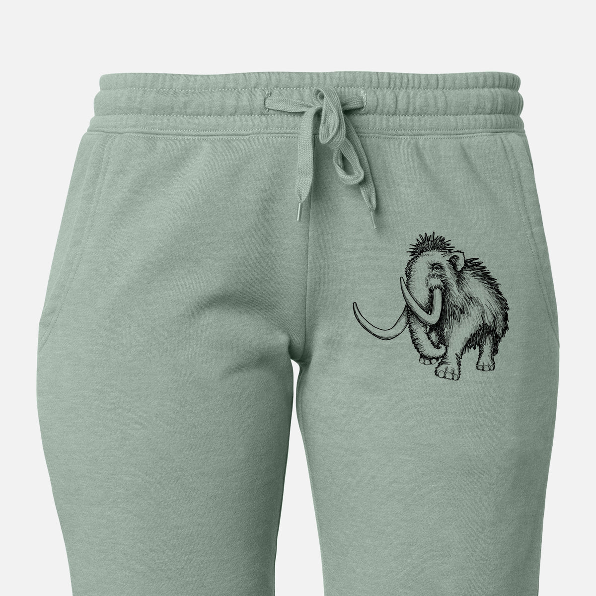 Front of sage green Cali Wave sweatpants, printed with a black ink illustration of a woolly mammoth with long curved tusks on the leg.