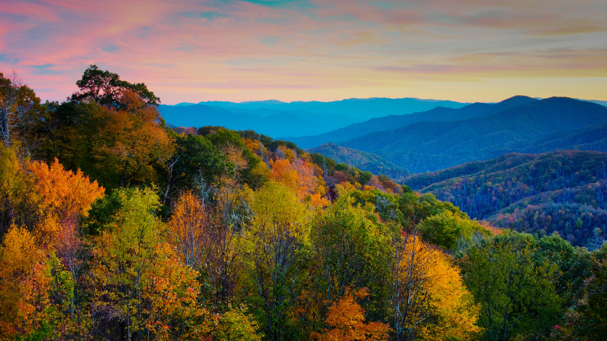 Stunning autumn sunset over the Smoky Mountains, highlighting the vibrant colors and scenic beauty for visitors to enjoy.