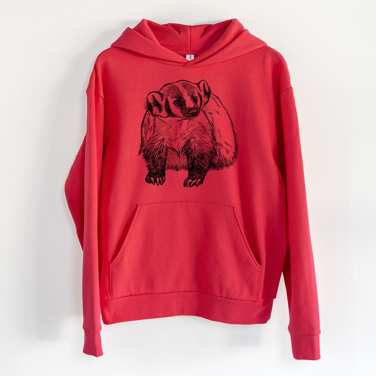American Badger - Taxidea taxus - Statement Midweight Hoodie in Cherry Red, hanging on a white wall, with a front kangaroo pocket and no drawcords.