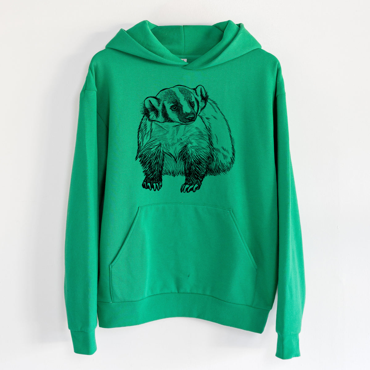 American Badger - Taxidea taxus - Statement Midweight Hoodie in Kelly Green, hanging on a white wall, with a front kangaroo pocket and no drawcords.
