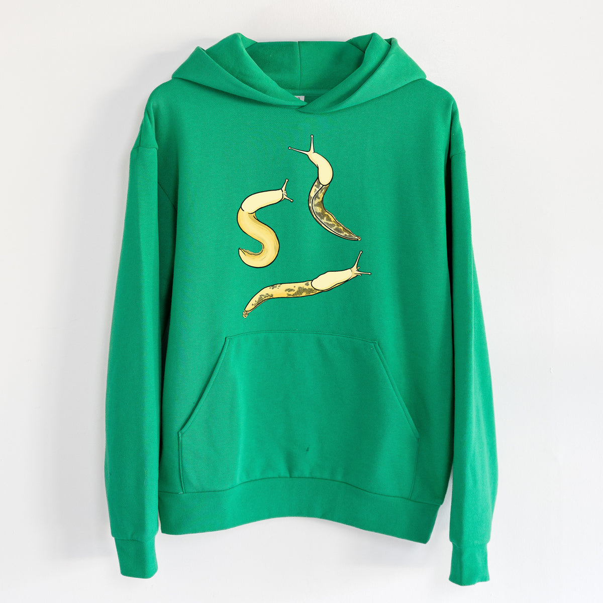 Banana Slug Squad - Ariolimax columbianus - Statement Midweight Hoodie in Kelly Green, hanging on a white wall, with a front kangaroo pocket and no drawcords.