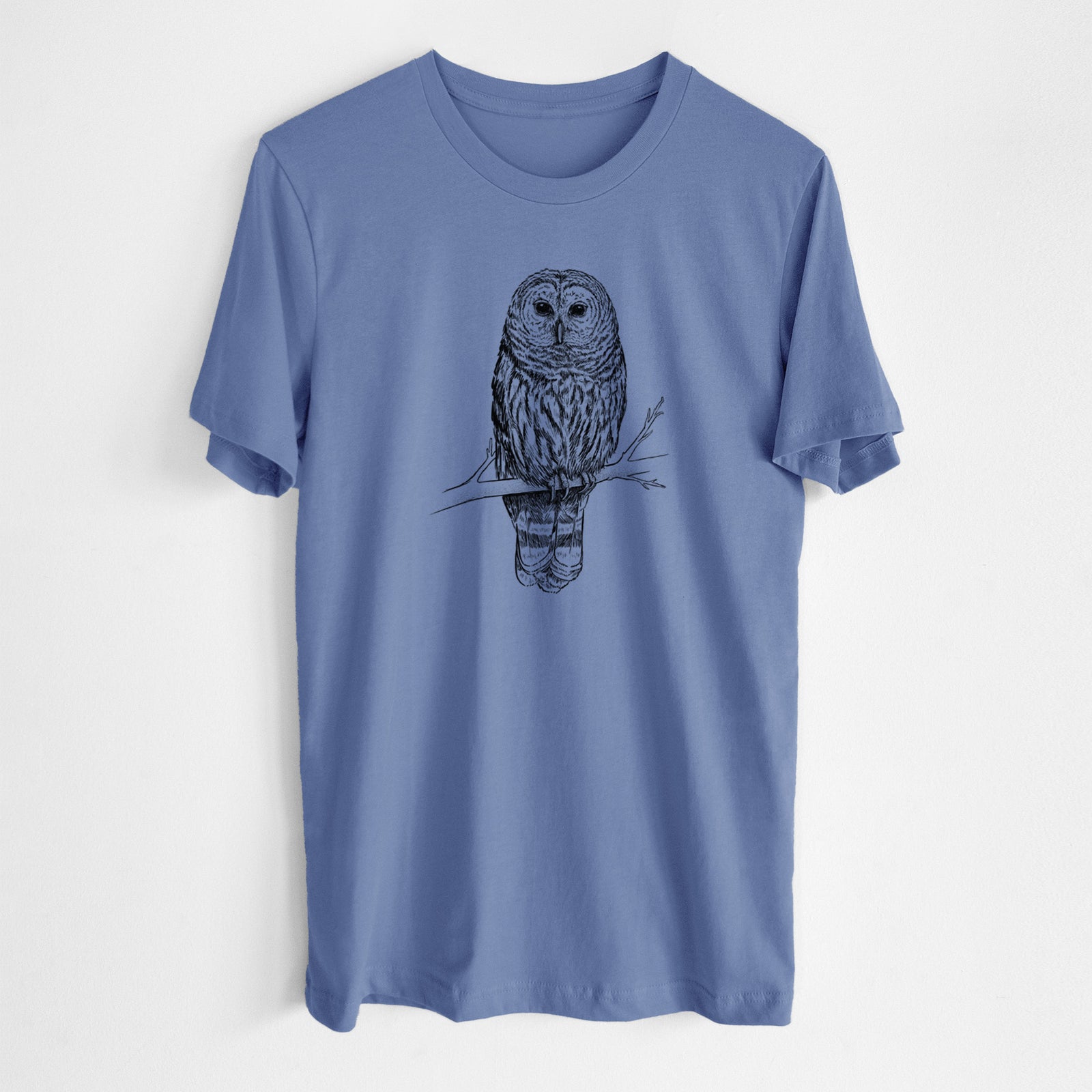 Blue t-shirt with an owl design on a white background