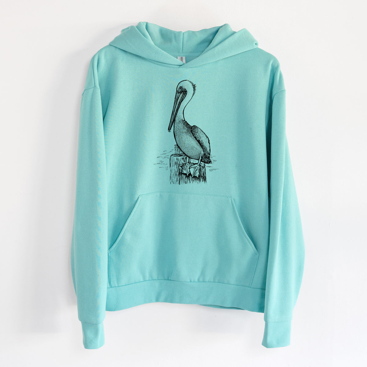 Pelecanus occidentalis - Brown Pelican - Statement Midweight Hoodie in Seafoam, hanging on a white wall, with a front kangaroo pocket and no drawcords.